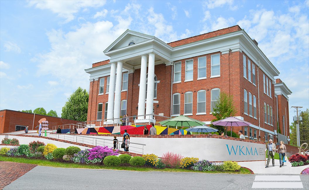Artist rendering of William King building from front with red brick, columns, and seating area with colorful umbrellas.
